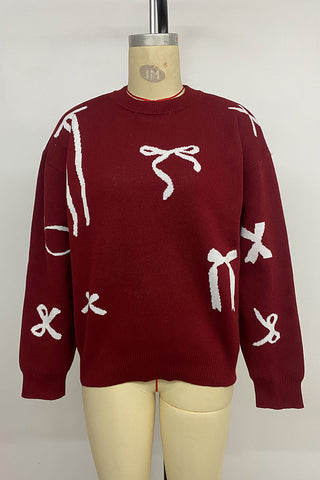 Festive Bow-Patterned Sweater