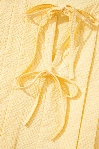 Sleeveless Textured Top with Bow Tie