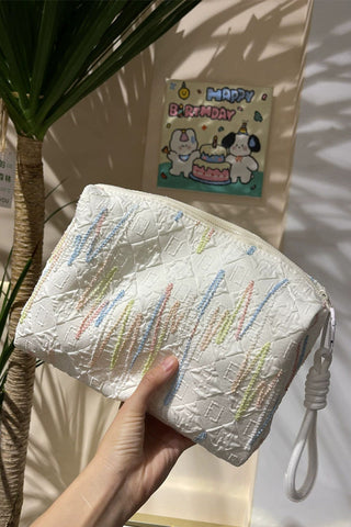 Embellished Textured Tassel Cosmetic Bag