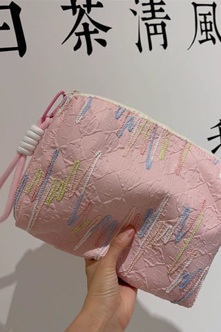 Embellished Textured Tassel Cosmetic Bag