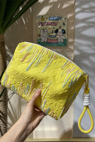 Embellished Textured Tassel Cosmetic Bag