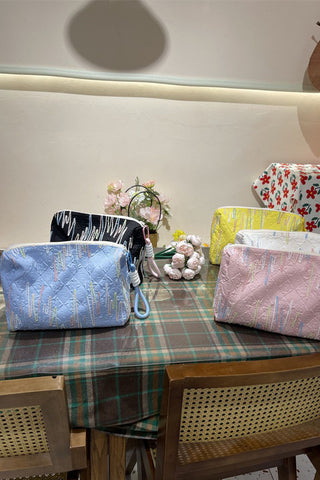 Embellished Textured Tassel Cosmetic Bag