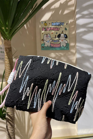Embellished Textured Tassel Cosmetic Bag