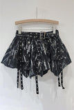 Edgy Belted Mini Skirt with Eyelet Detailing