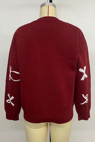 Festive Bow-Patterned Sweater