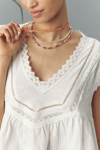 Lace-Trimmed Sleeveless Ruffle Top
