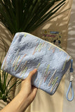 Embellished Textured Tassel Cosmetic Bag